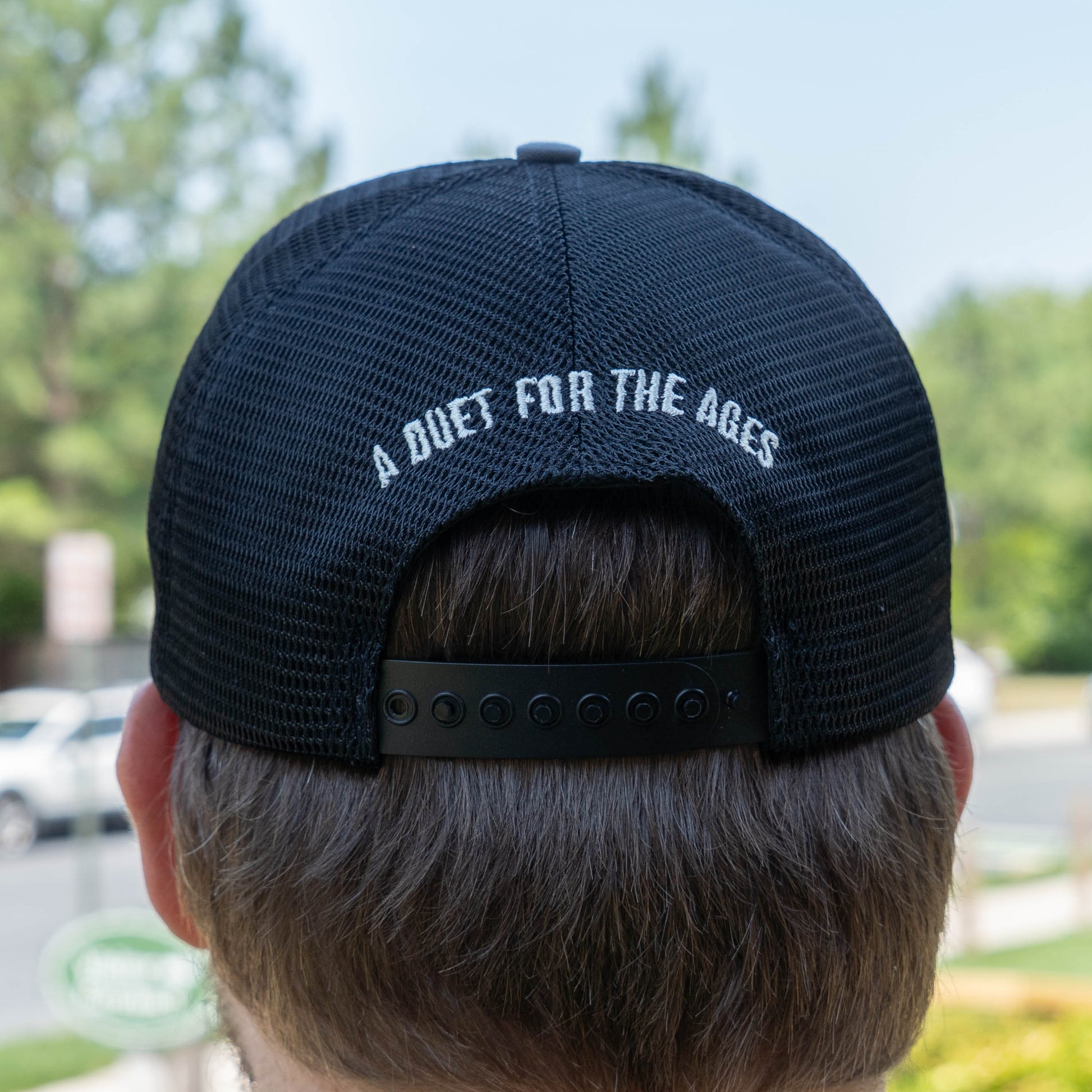 Dogfish Head x Rolling Stone trucker hat with black mesh back and snapback with 'A Duet For The Ages' text on the back