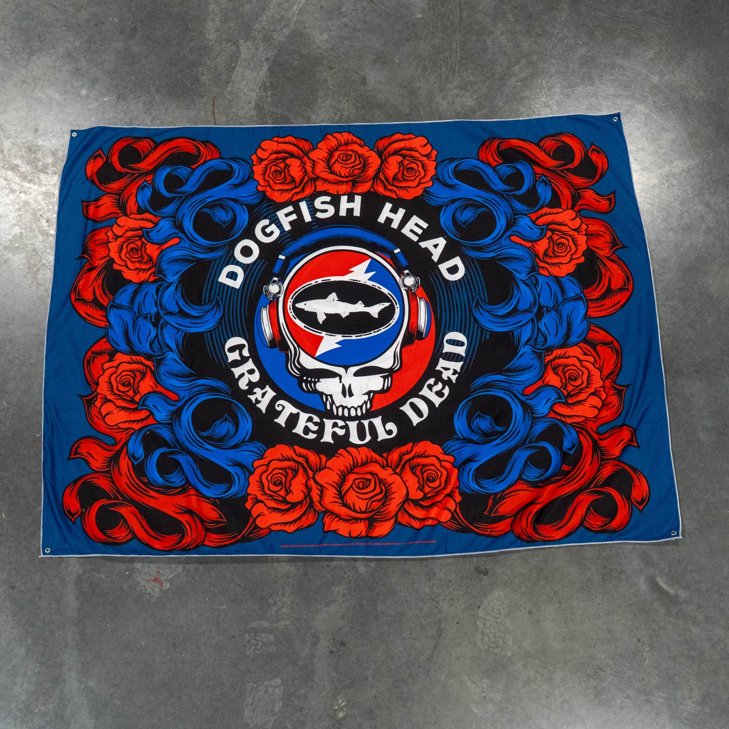 Dogfish Head Grateful Dead logo with roses on a blue background