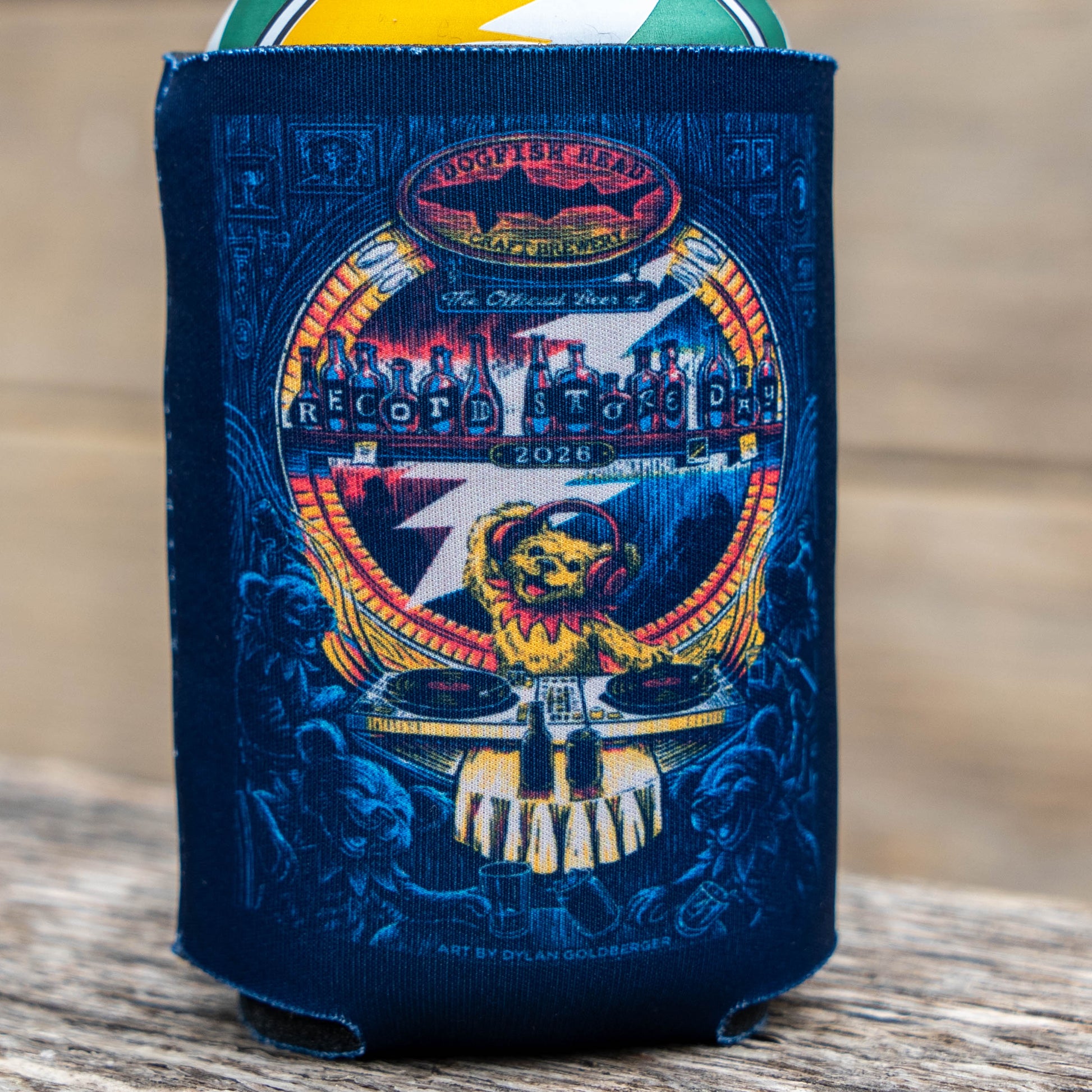 Close‑up of the detailed illustrated artwork on the Dogfish Head x Grateful Dead Record Store Day can cooler, featuring the grateful dead bear DJ artwork