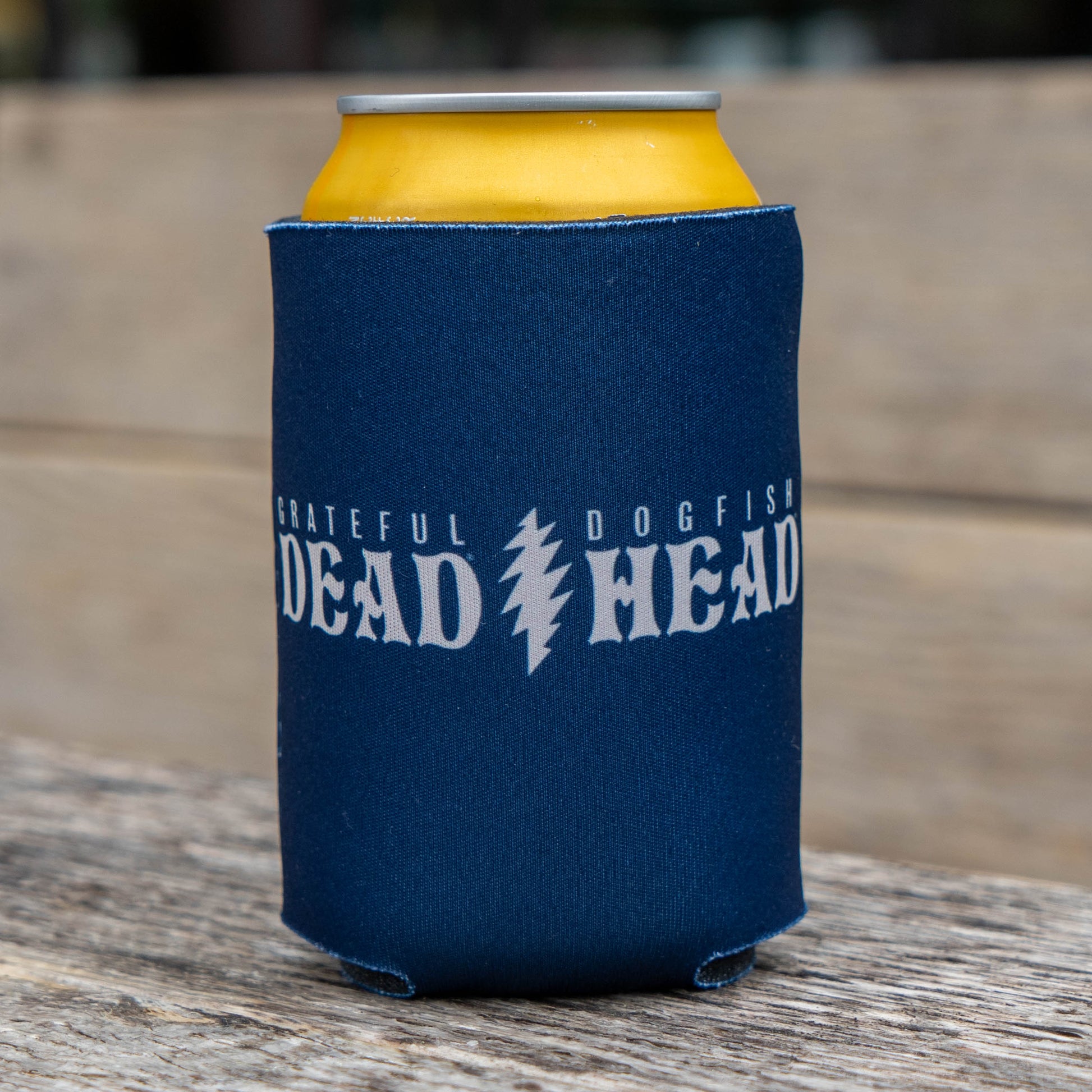 Dogfish Head x Grateful Dead Record Store Day can cooler in navy blue neoprene, featuring bold white Grateful Dead and Dogfish Head logos on the front.