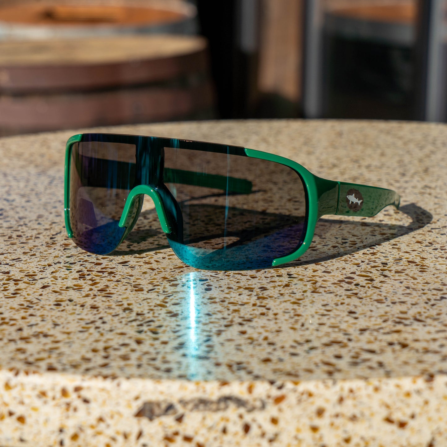 Green Dogfish Head Polarized Sunglasses with Cool tone, blue and purple reflection on the lenses