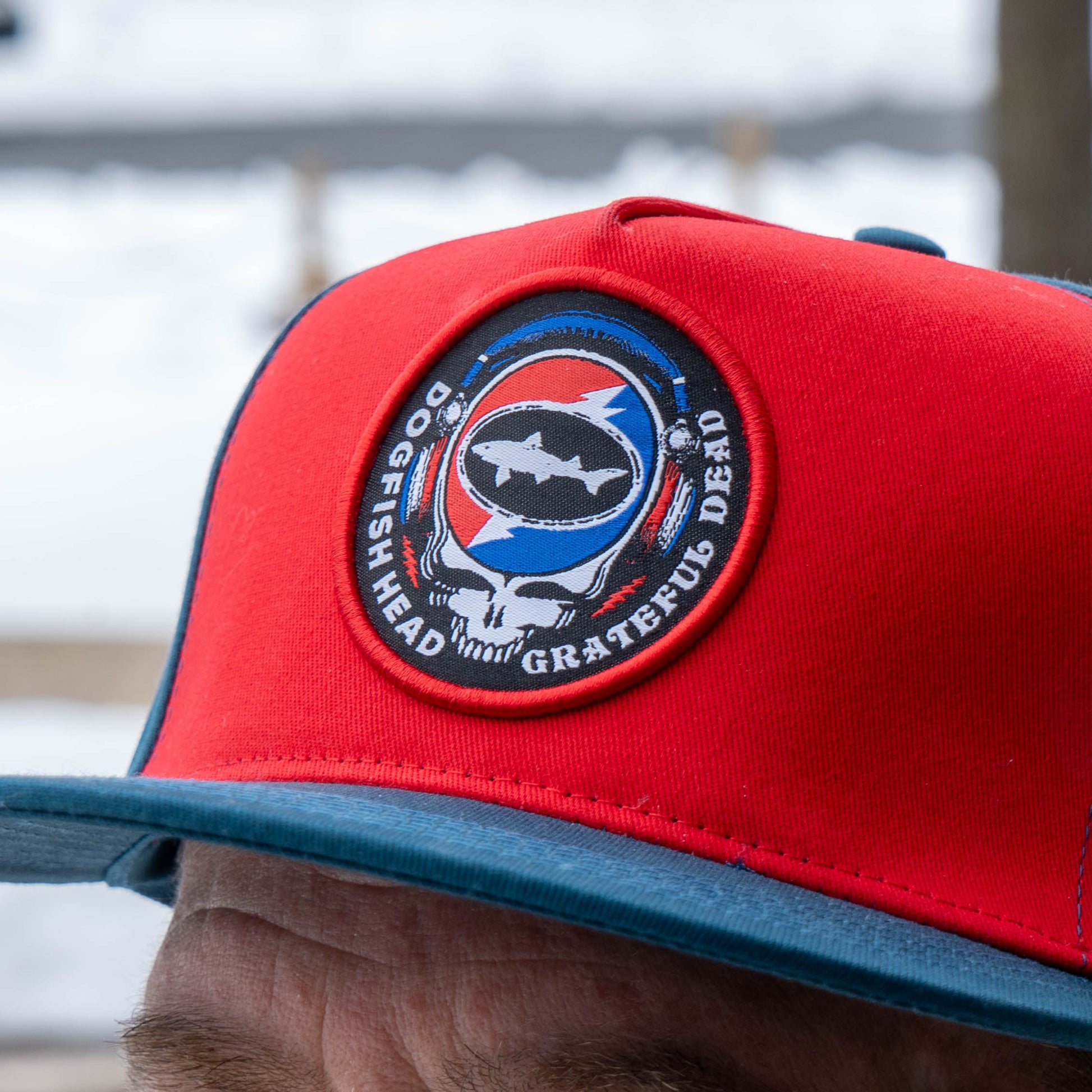 Close up of Dogfish Head x Grateful Dead logo in red, white and blue 