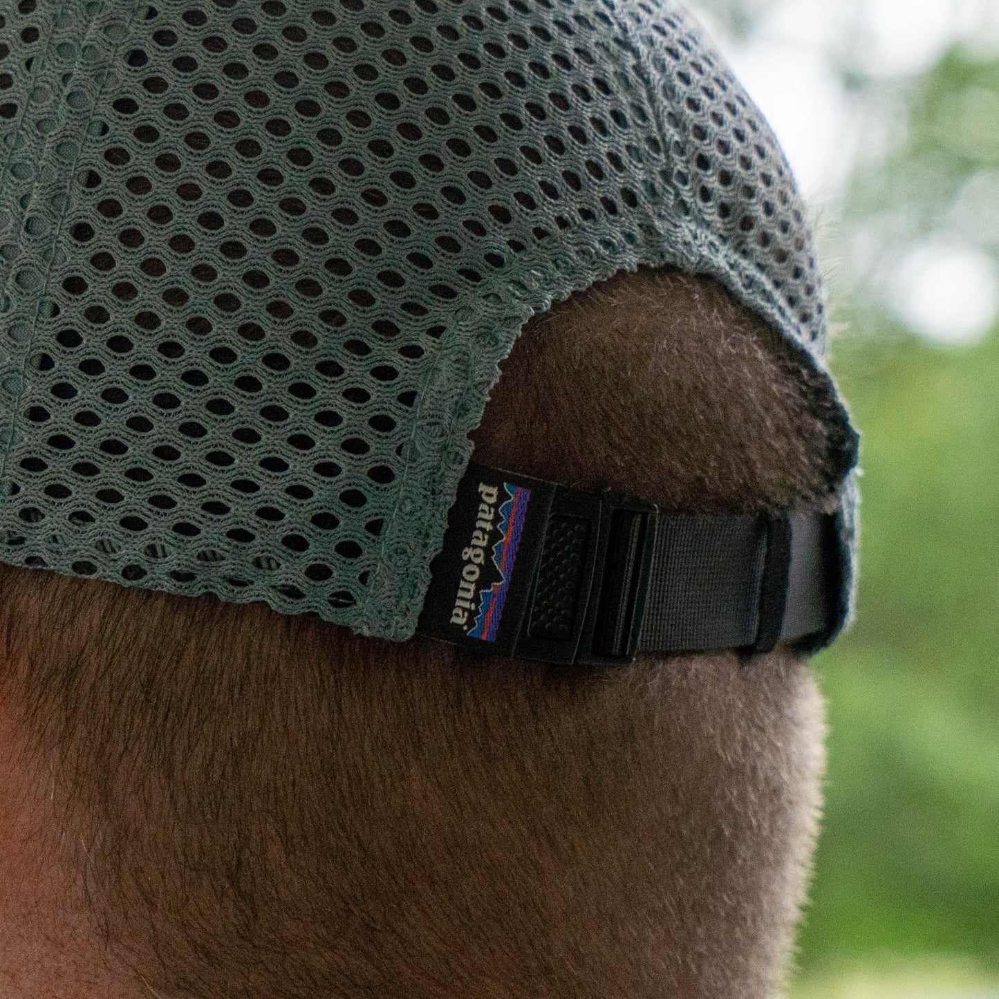 Close-up of mesh panel and adjustable strap on Patagonia Spoonbill hat, breathable performance trucker for summer wear