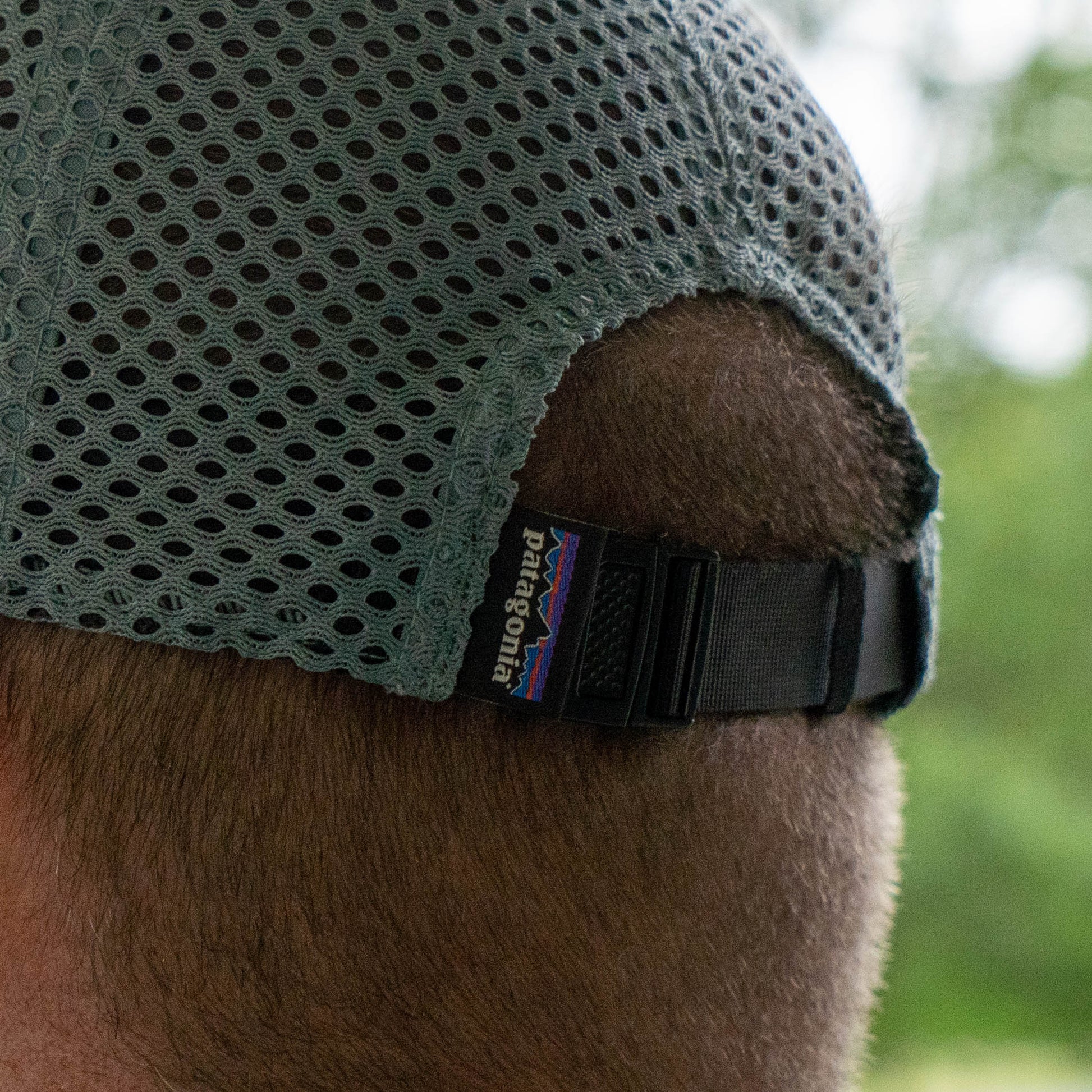 Close-up of mesh panel and adjustable strap on Patagonia Spoonbill hat, breathable performance trucker for summer wear