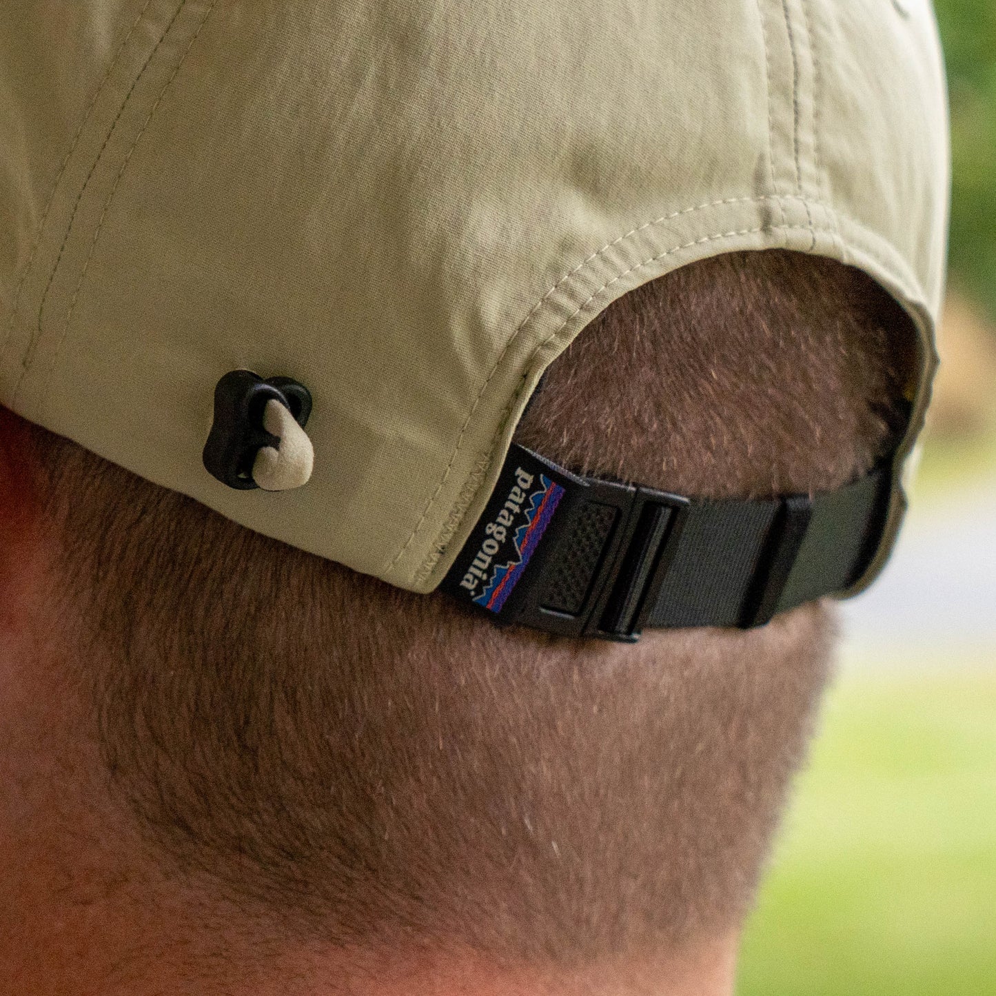 Close up of adjustable strap and patagonia tag on the back of spoonbill merganzer hat 