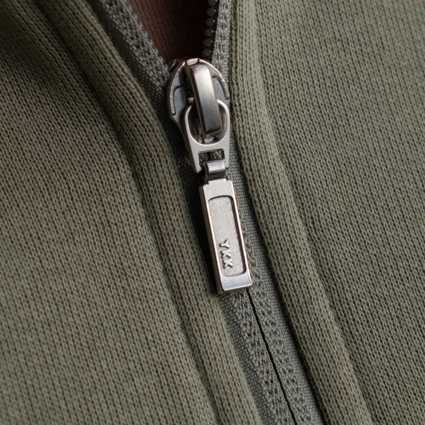 Close up of zipper on mineral quarter zip pullover sweatshirt