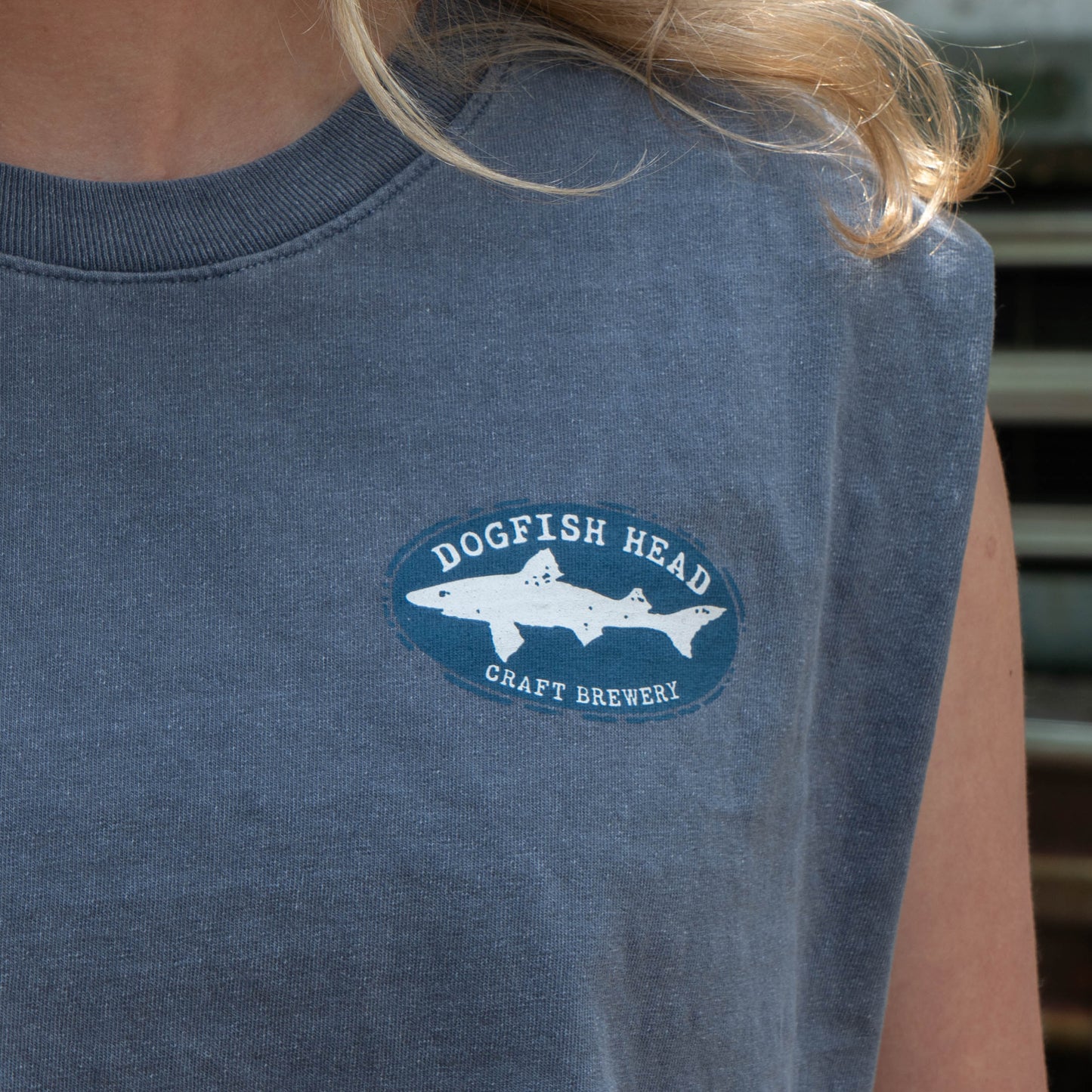 Person wearing a blue t-shirt with Dogfish Head Craft Brewery logo