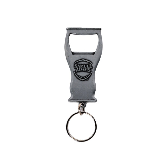 A metal keychain bottle opener in the shape of a perfect pint.