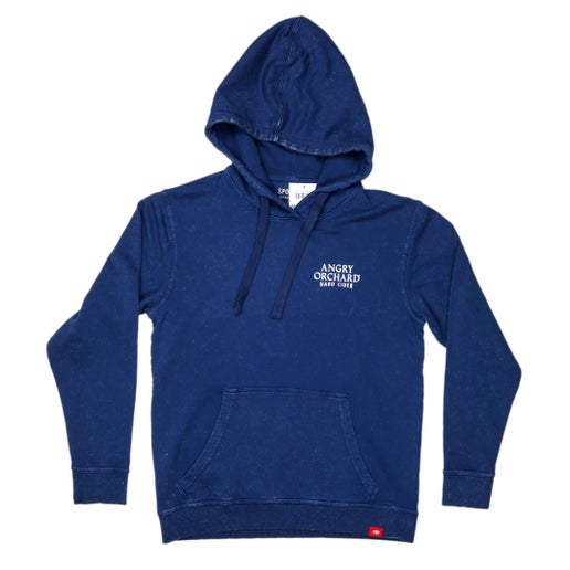 Front of blue hoodie features "Angry Orchard Hard Cider" written in white on left side of chest. 