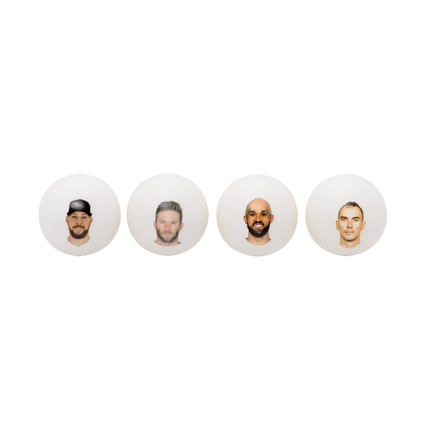 Four white ping pong balls with headshots .