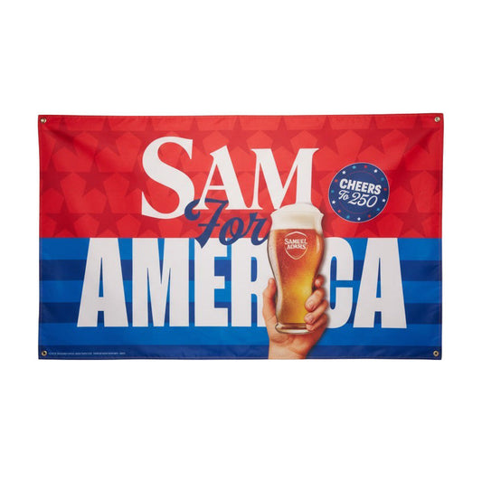 Samuel Adams Sam for America 250 flag with red, white, and blue design featuring raised beer glass and “Cheers to 250” graphic with a hand holding a pint of Samuel Adams beer