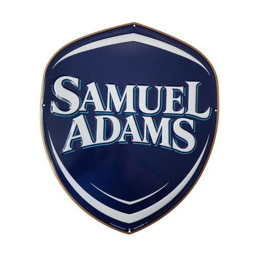 A Sam Shield Logo Tacker. Size is approximately 18.5" long and 16.5" wide. There are 4 holes for hanging.