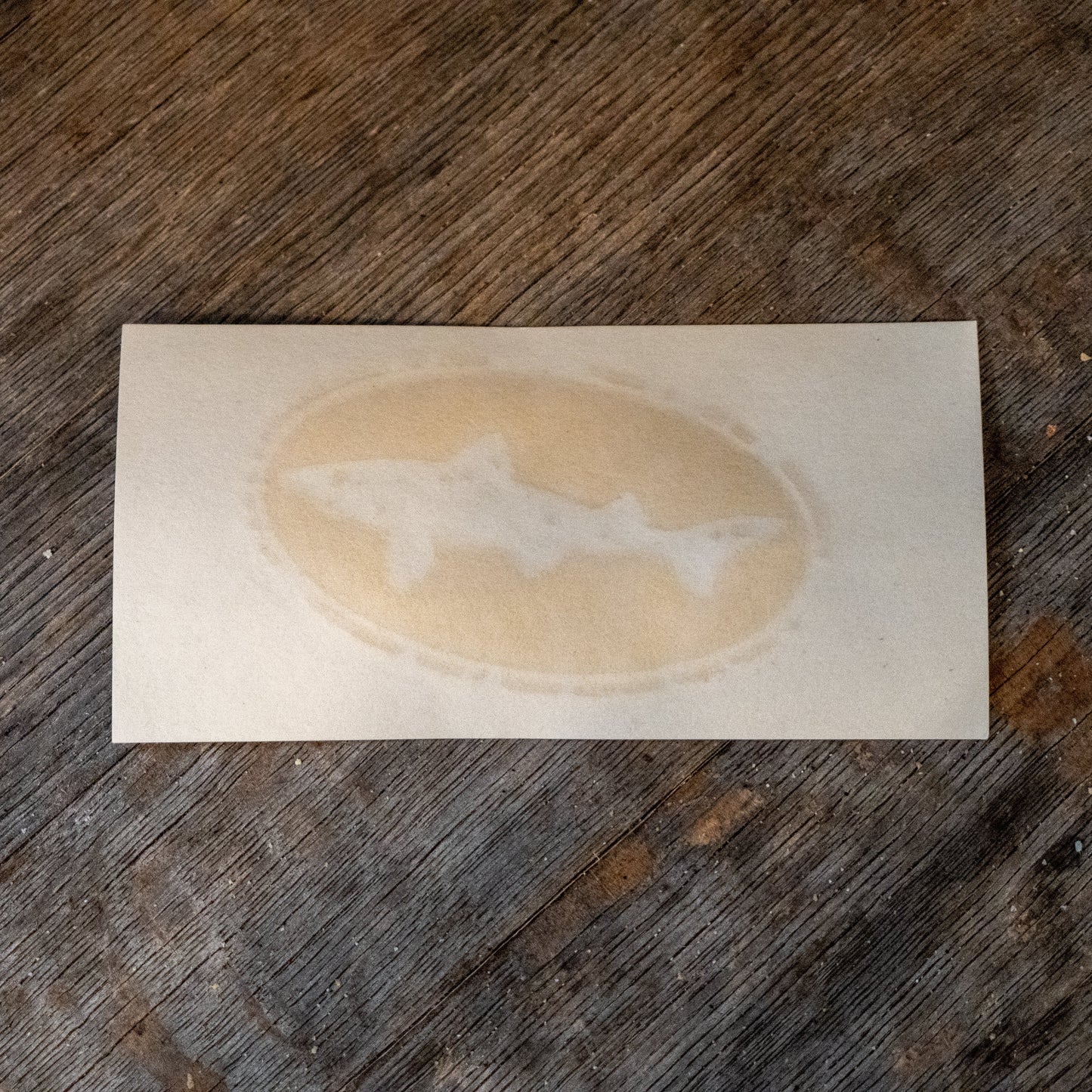 A 4-inch Logo Decal from KCB Print Resources features three stylized sharks in an oval coffee ring design, ideal for unique vinyl transfers on various surfaces.
