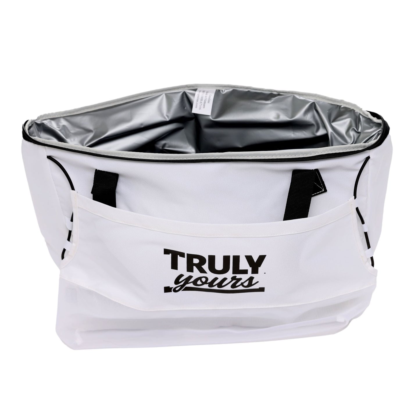 A white insulated cooler bag with black handles and a front pocket. The front pocket displays the phrase 'TRULY yours' in black lettering—'TRULY' in bold uppercase and 'yours' in a cursive font. The bag’s interior is lined with a silver, reflective thermal material designed to maintain temperature. The bag has a rectangular shape and appears to be made of durable fabric.