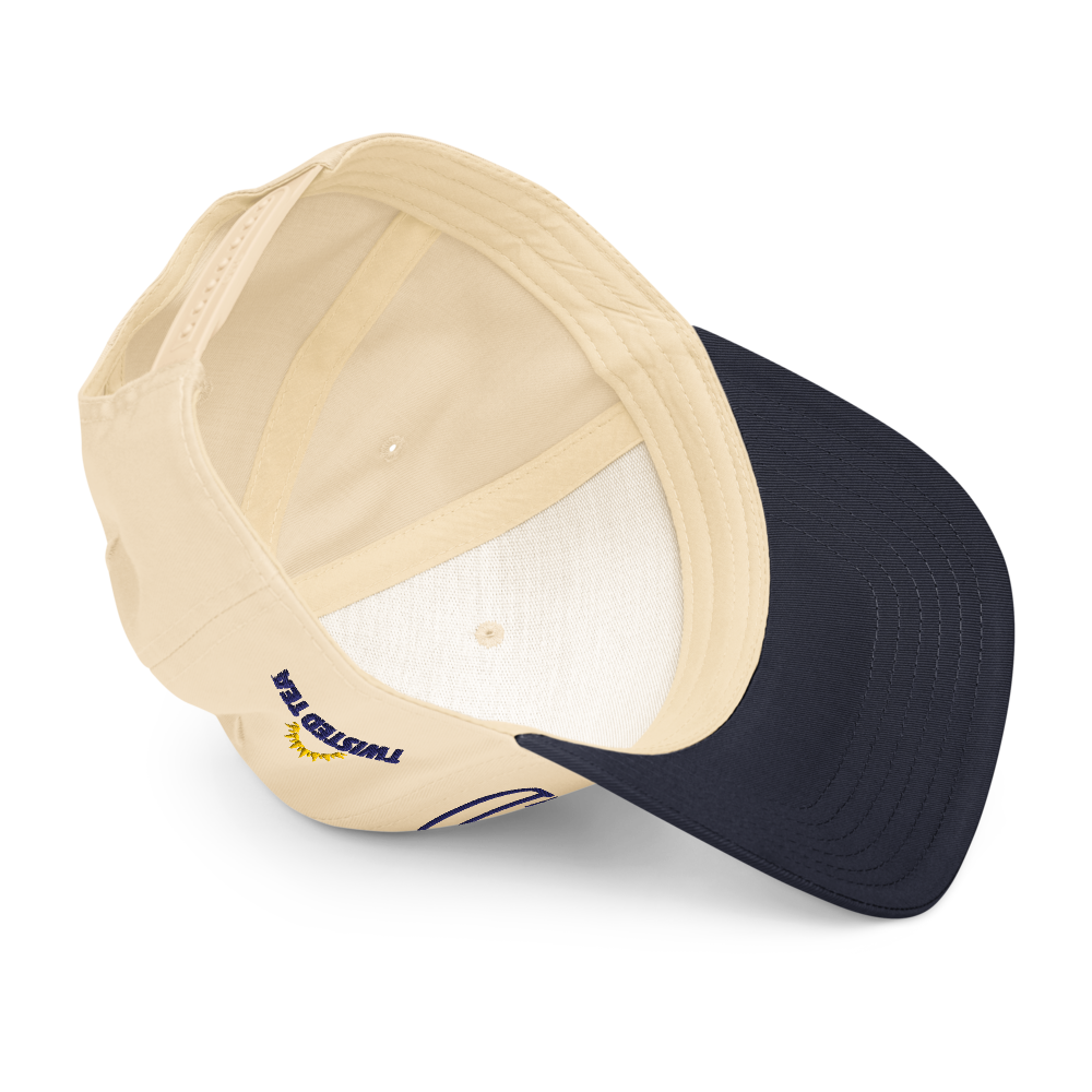 Interior view of Twisted Tea baseball cap showing cream fabric panels, navy brim underside, and branded stitching.