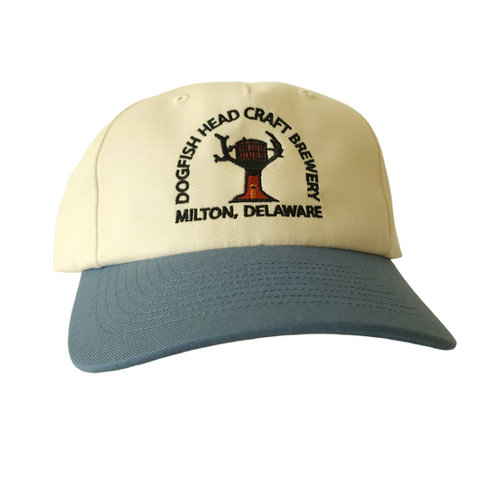 Cream hat with blue brim. Embroidered front with Dogfish Head Craft Brewery Milton, DE text. 