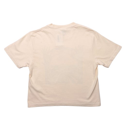 Back of tee is solid cream.