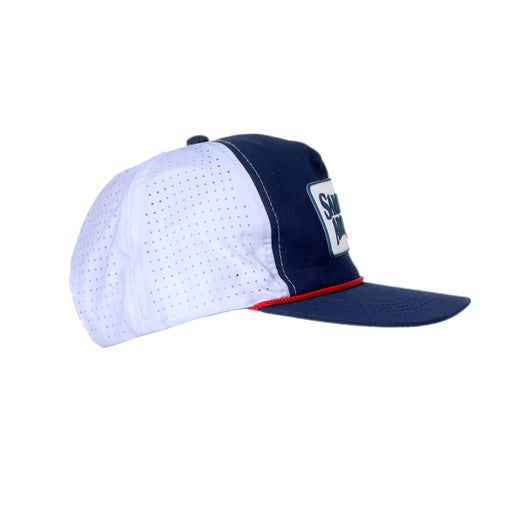 Side view of navy trucker hat with red rope piping and a white Samuel Adams patch on the front.