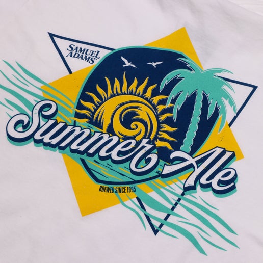 Front and back view of a white Samuel Adams t-shirt with “Summer Ale” text on the front pocket and a large, colorful summer-themed graphic on the back featuring a sun, palm tree, ocean waves, and the Samuel Adams logo.