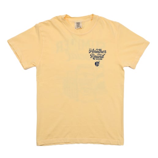 Front and back view of a pastel yellow short sleeve t-shirt featuring a small “It’s Another Round Season” graphic on the front chest and a large beach-themed “Summer Social” Samuel Adams Summer Ale design on the back, including a can, cooler, lighthouse, and seagulls.
