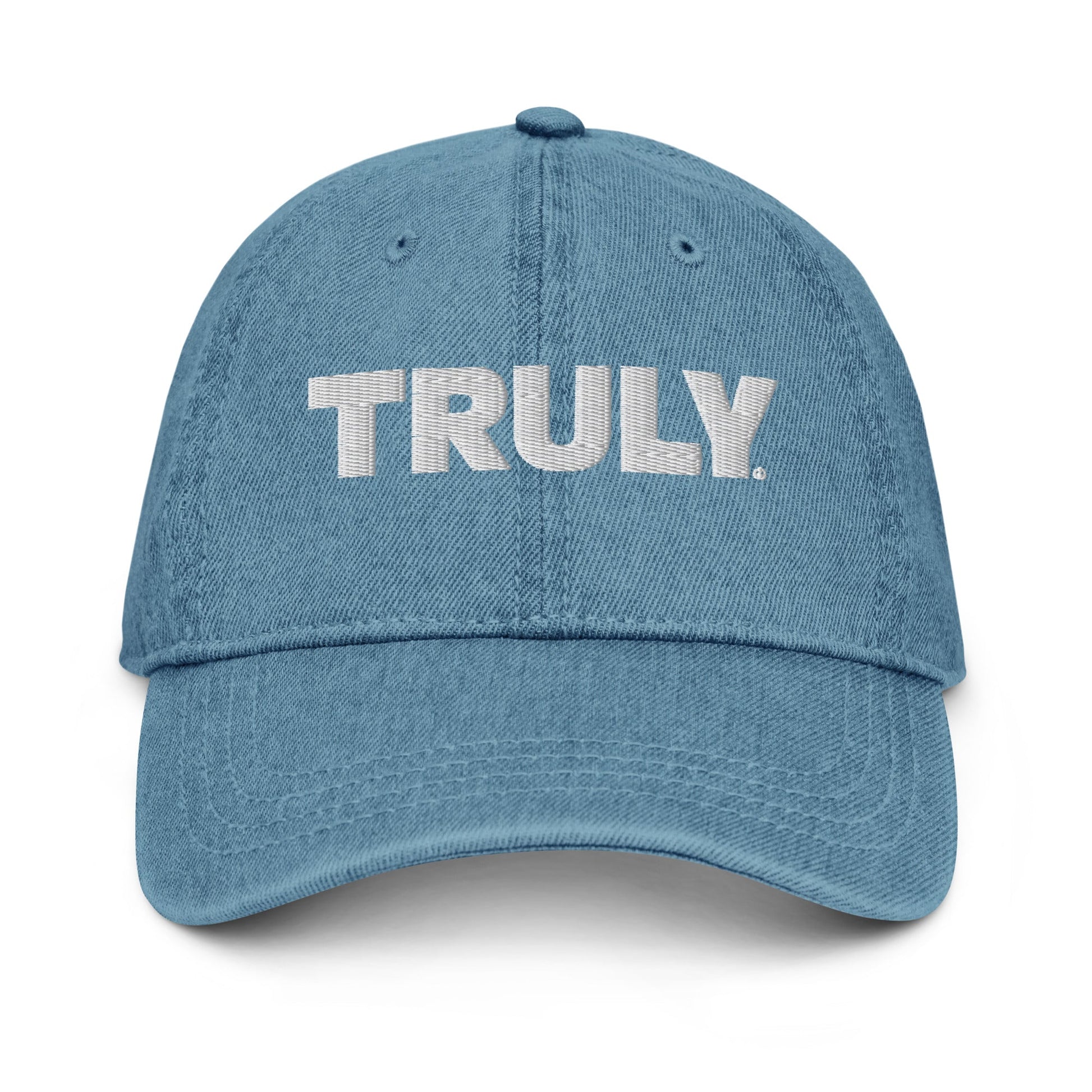 Light blue denim dad hat with a white Truly Logo front and center 