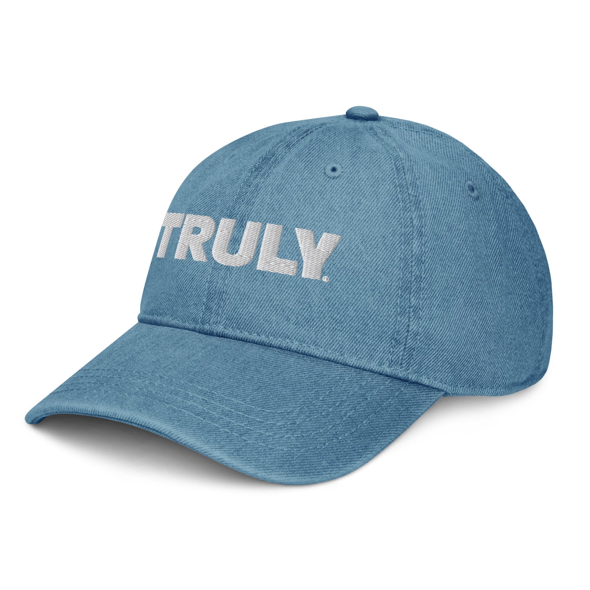 Light blue denim dad hat with a white Truly Logo front and center 