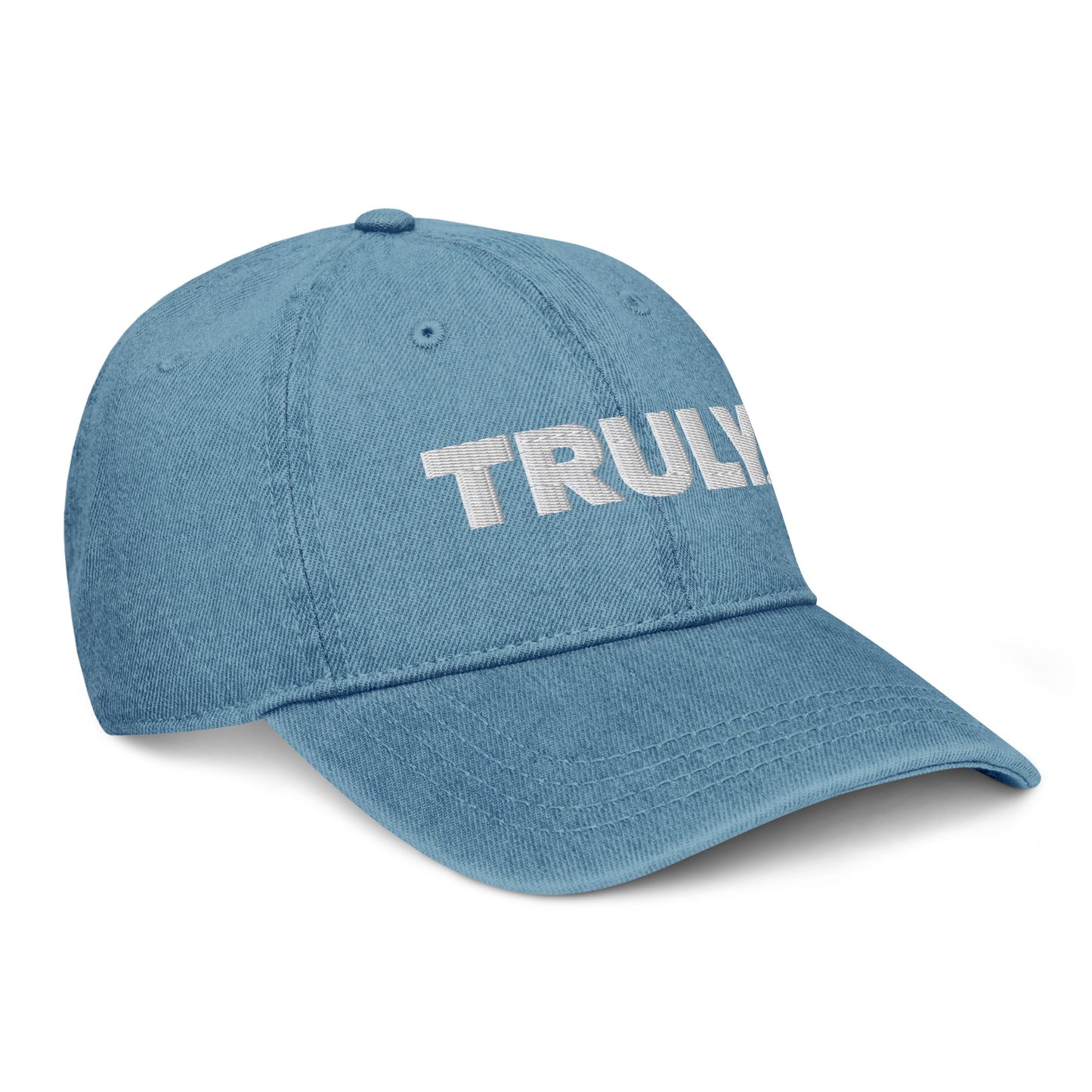 Light blue denim dad hat with a white Truly Logo front and center 